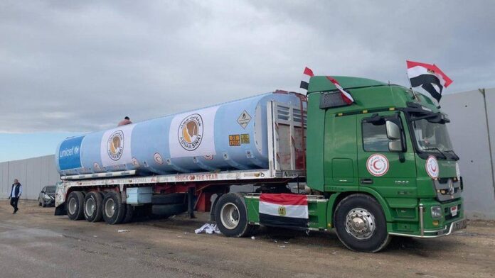 In a critical development, the first truck delivering fuel to the Gaza Strip since the imposition of a total siege by Israel began its journey from Egypt on Wednesday, according to two Egyptian security sources