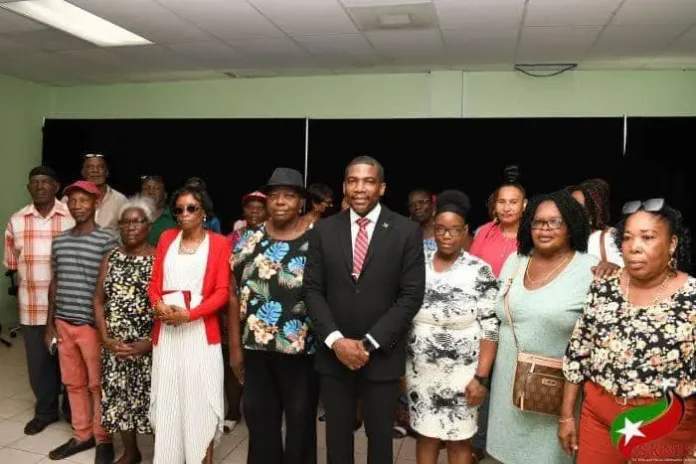 Prime Minister Dr. Terrance Drew with the pension receivers of Government Auxiliary Employees