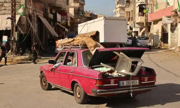 Lebanese families flee their homes amid escalations in cross-border tensions as fighting continues between Israel and Hamas militants. Photograph: Rabih Daher/AFP/Getty Images