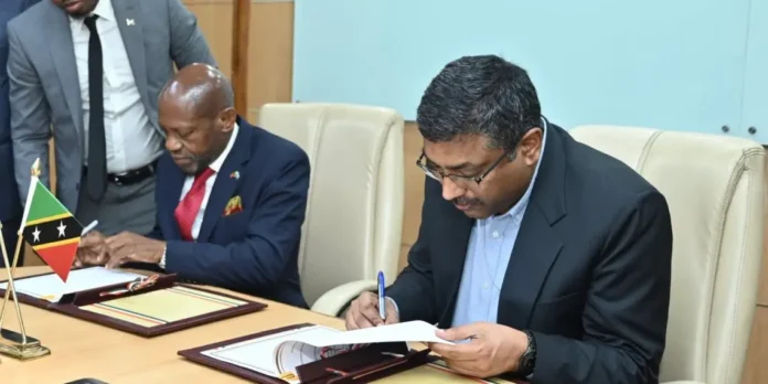 Foreign Minister Denzil Douglas while signing the MoU in India