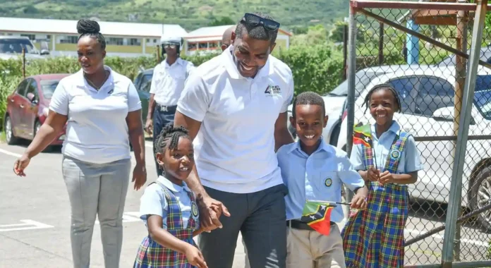 Prime Minister Dr. Terrance Drew with primary school children