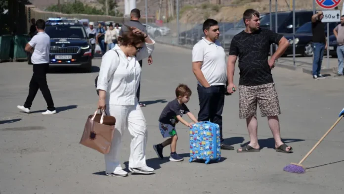 For now, the road out of Iran remains open at Agarak, and every hour, more people are making the arduous journey to the border