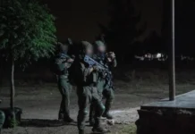 IDF soldiers conduct a nighttime operation near the Israel-Syria border, arresting members of an Iranian-linked terror cell and seizing weapons to prevent cross-border threats