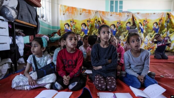 Palestinian students study amid ruins in Gaza, where university destruction has forced many to seek education opportunities abroad