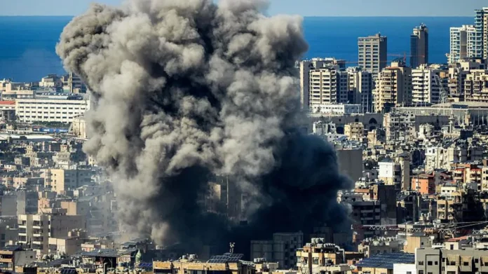 Smoke rises over Iranian oil facilities after Israeli strikes as the expanding conflict threatens regional security and global energy supplies