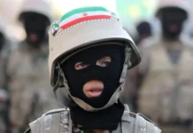 Iran Child Recruitment Concerns Rise After Boy Killed At Checkpoint Checkpoint in Tehran where reports suggest minors were deployed alongside security forces amid rising tensions and alleged recruitment initiatives